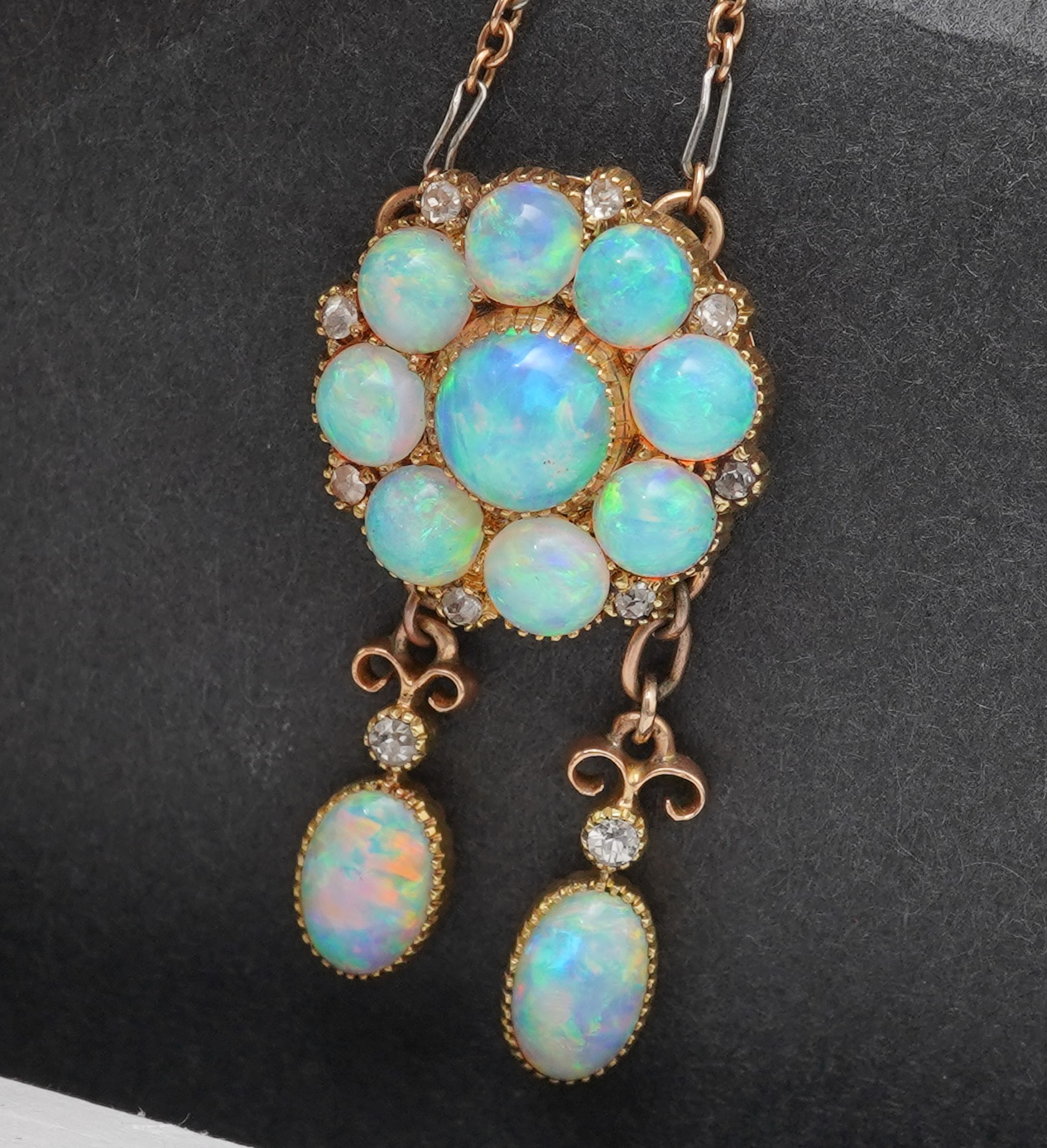 An attractive Edwardian opal and diamond demi-parure, early 20th century